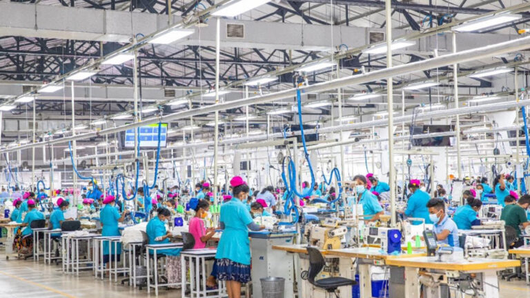Star Garment Factory |Workers in blue uniforms operating sewing machines in