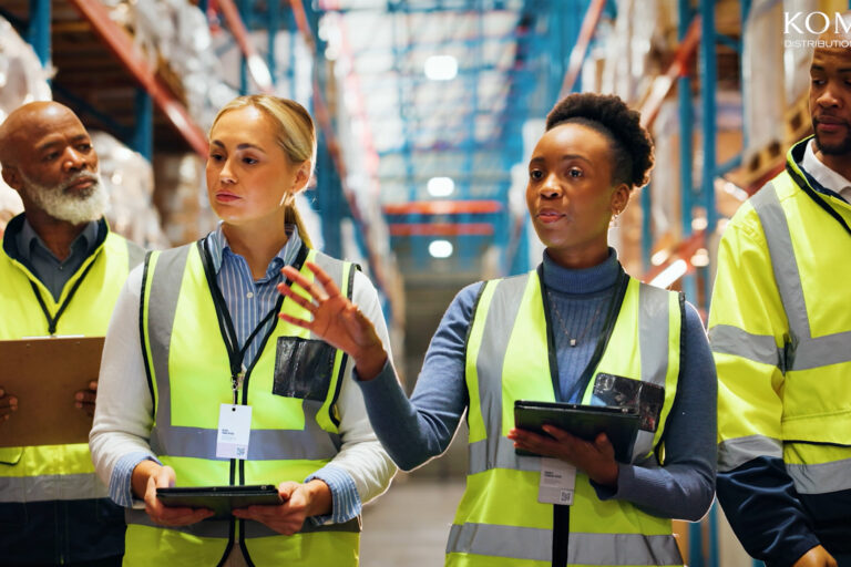Komar Distribution warehouse operations with staff handling goods